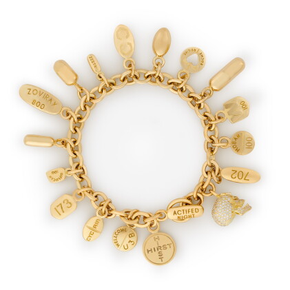 Catalog image of pharmaceutical pills with diamond skull, charm bracelet