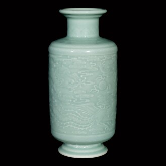 View 1 of Lot 22: A rare carved celadon-glazed 'dragon and phoenix' vase Seal mark and period of Yongzheng | 清雍正 粉青釉龍鳳戲珠紋燈籠瓶 《大清雍正年製》款