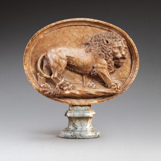 View 1 of Lot 74: Italian, probably 18th century, after the Antique, Relief of a Pacing Lion | Italie, probablement XVIIIe siècle, d'après l'Antique, Relief de Lion Marchant