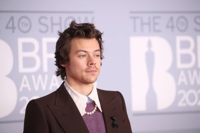 Harry Styles in blazer, collared shirt and pearl necklace at the Met Gala 2021