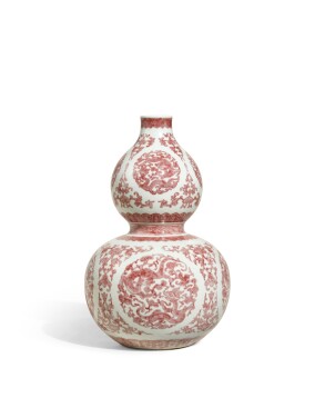 View 1 of Lot 1082: A fine and rare copper-red decorated 'chilong' double-gourd vase, Seal mark and period of Qianlong | 清乾隆　釉裏紅團螭靈芝紋葫蘆瓶　《大清乾隆年製》款