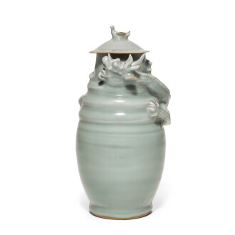 View 1 of Lot 38: A rare Longquan celadon 'dragon and bird' jar and cover Southern Song dynasty | 南宋 龍泉窰青釉塑龍紋蓋罐