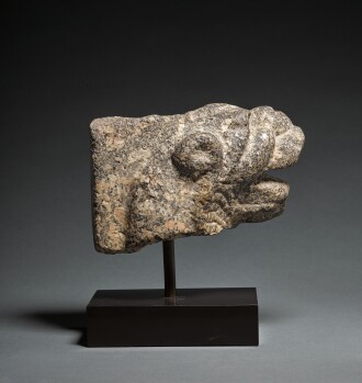 View 1 of Lot 10: A Granite Feline Head Terminal from a Trapezophoros (Table Leg), Roman Egypt, circa 2nd Century A.D.