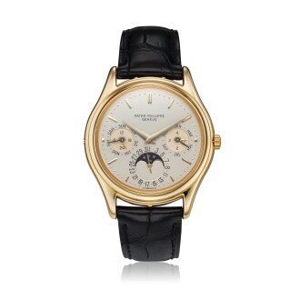 View 1 of Lot 23: Reference 3940 'First Series'  A yellow gold perpetual calendar wristwatch with moon phases, 24-hour, and leap year indication, Made in 1987