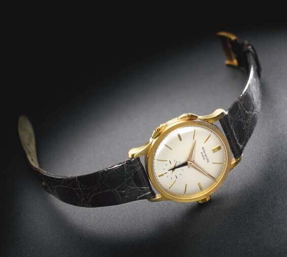 A FINE AND RARE 18K YELLOW GOLD DUAL TIME ZONE WRISTWATCH WITH A
