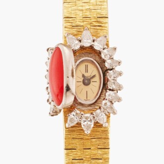 View 1 of Lot 127: Reference 1428 A 6 | A yellow gold, diamond, and coral-set concealed dial bracelet watch, Circa 1969