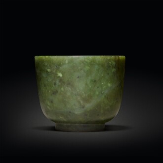 View 1 of Lot 603: A spinach-green jade cup, Qing dynasty, 18th / 19th century | 清十八 / 十九世紀 碧玉小盃