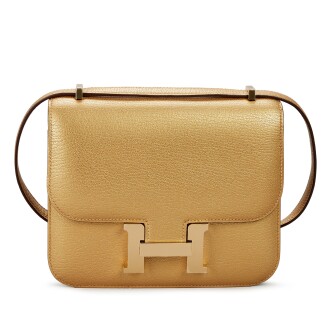 View 1 of Lot 39: Limited Edition Dore Chèvre Chamkilight Metallic Mini Constance 18 Permabrass Hardware, 2024