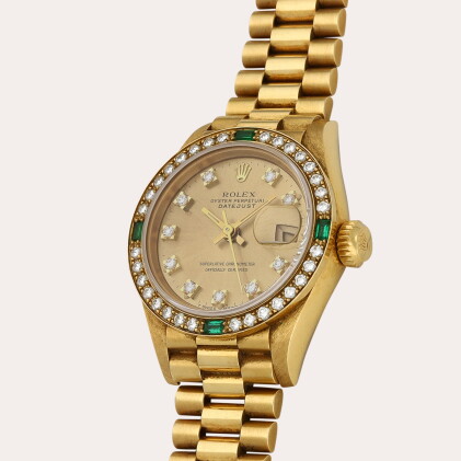 Catalog image of Lady Datejust, Reference 69078 | A yellow gold, emerald- and diamond-set wristw…