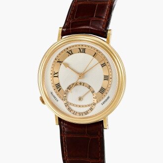 View 1 of Lot 46: Millennium | A limited edition yellow gold wristwatch with date | Made in 2001