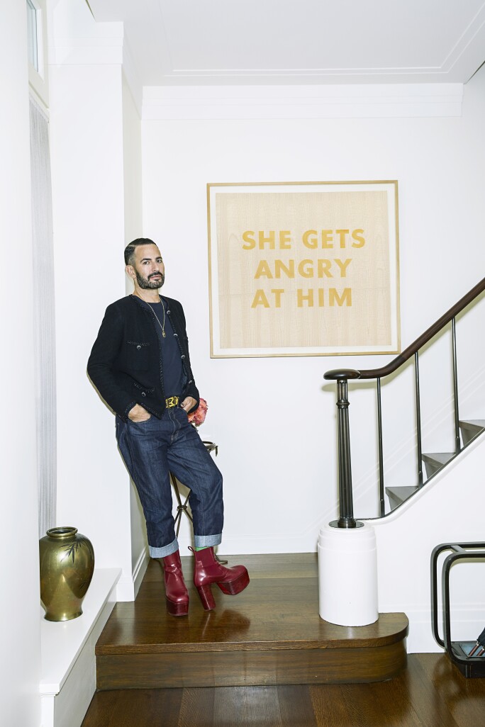 JACOBS WITH ED RUSCHA'S SHE GETS ANGRY AT HIM, 1974, IN THE FOYER OF HIS HOME. Photograph by Victoria Stevens.