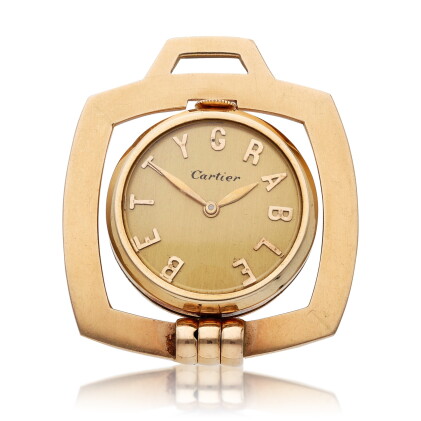 Catalog image of 'Betty Grable' Retailed by Cartier, A yellow gold desk timepiece, Circa 1955