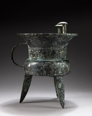 View 1 of Lot 86: A rare and important archaic bronze goblet, Jia Early Shang dynasty | 商期 青銅饕餮紋斝 